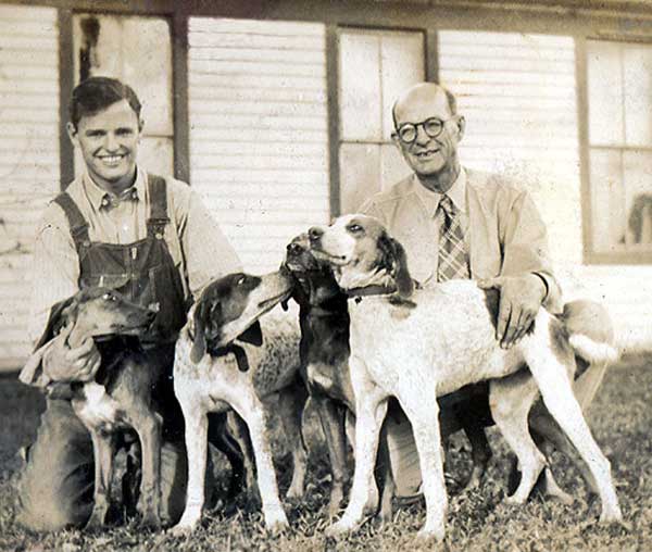 Bobby and his dad with hounds